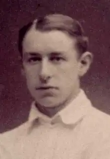 Black and white photo of a young Paul Loicq dressed in a white shirt