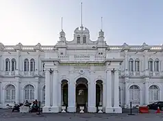 Front façade of the City Hall in George Town, featuring the portico with Edwardian and Baroque architectural styles.