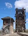 View of vertical lift bridge in raised position and of the control tower