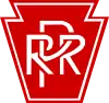 White letters "PRR" on keystone-shaped, red background