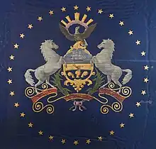 A Pennsylvanian state flag from 1863, featuring a ring of stars around the coat of arms. It was made in November 1863 by a Philadelphian flag manufacturer for Governor Curtin's use during the Gettysburg National Cemetery's dedication on November 19, 1863.