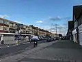 Shops on Queensway, west of the railway