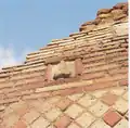 A phallus on the side of a building in Pompeii. Terracotta plaques with images of phalluses were set into the walls on streets in Pompeii.