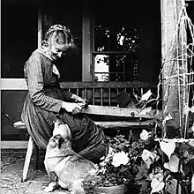 Tasha Tudor shaving splints from a log on her Vermont farm in 1977