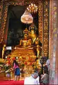 The statues of Phra Phuttha Chinnasi (front) and Phra Suwannakhet (back) in the main shrine hall. The ashes of King Rama IX are kept under the base of the statues