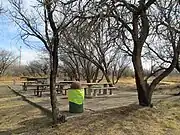 A picnic area built on the foundation of a false front store..