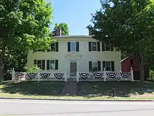 Photograph of a white house.