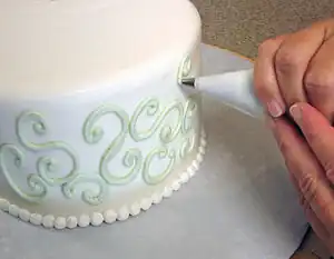 Buttercream decorations being added