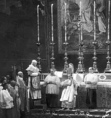 Pope Pius X (left) wearing the papal vestments at the episcopal consecration of Giacomo della Chiesa (later Benedict XV)