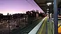 Westbound view from Platform 1, January 2021. The junction of Punt Road and Olympic Boulevard is to the left, with AAMI Park in the distance.