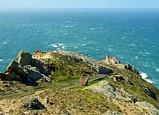 Long stairs leading down to the lighthouse.