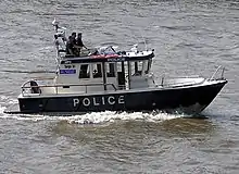 A Metropolitan Police launch on the River Thames in London