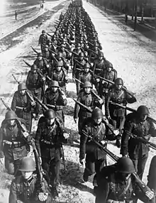 Photo of a column of troops marching