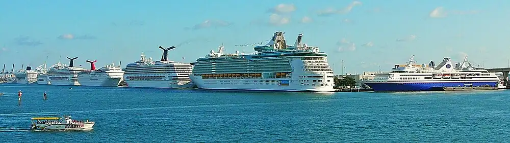 PortMiami is the world's busiest cruise ship port and headquarters to many of the world's largest cruise companies. From left to right: Hapag-Lloyd Europa, Norwegian Sky, Oceania Nautica, Carnival Valor, Carnival Imagination, Carnival Liberty, Royal Caribbean Liberty of the Seas, MV Explorer