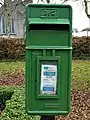 Irish Green postbox at Adare, County Limerick, with the P⁊Ꞇ (P&T) logo