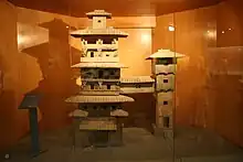 An earthenware model of two residential towers, made during the Han dynasty in China.