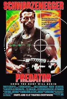 A muscular soldier holds a machine gun. The background is in the style of a brightly colored thermal map. The foreground contains a target symbol. The name Schwarzenegger is in large red letters at the top of the poster and the film title is in the same size and below the picture.