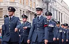 Members of the Royal Air Force wearing peaked caps (July 2011) including a white example worn by an RAF Police airman at the front right.