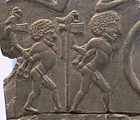 The prisoners on the Battlefield Palette may be people of the Buto-Maadi culture subjected by the Egyptian rulers of Naqada III.