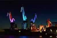 Light design by Dean Skira on cranes in Pula harbour