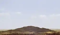 A photograph of the mound of sand that comprises the destroyed remains of the pyramid, called 'Merenre's beauty shines', which belonged to Merenre Nemtyemsaf I.