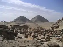 A photograph of two pyramids