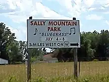 Sign directing attendees to Sally Mountain Park, site of a large Bluegrass music festival hosted annually by Rhonda Vincent and her family.