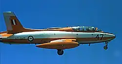 Side view of two-seat, single-engined military jet in flight with wheels down