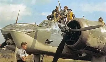 Wartime colour photograph of a Blenheim Mk IV with crew and ground crew.