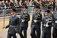 Officer (with sword belt) and men of the RAF Regiment.