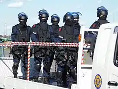 Anti-Firearms Squad of Japan armed with MP5 submachine guns. Some are equipped with Brügger & Thomet Foldable Visor Helmet Stocks.