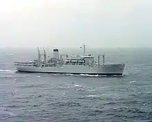 A grey ship with a helipad aft