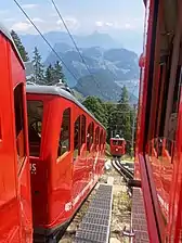 Final railcar of a group approaches the midpoint