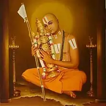 Ramanuja is one of the most important exponents of the Sri Vaishnavism tradition within Hinduism, depicted with Vaishnava Tilaka and Varadraja (Vishnu) statue.