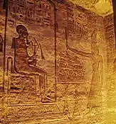 Ramesses offering to seated god Ptah. Frieze inside the Small Temple.