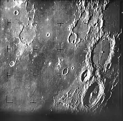 First image, about 17 minutes before impact. Features: The large crater at center right is Alphonsus.