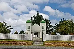 The Rātana Church at Te Kao is characterised by bell towers at each of the front corners, which bear the words "Arepa" and "Omeka" (Maori transliterations of the Greek words Alpha and Omega – the beginning and the end)