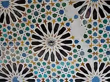 Zellij with 16-pointed star motifs in the Mexuar of the Alhambra in Granada (14th century; with later Spanish emblem inserted in the center)