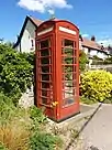 Photograph of the K6 Telephone Kiosk (red telephone box) in Front Street, Churchill.