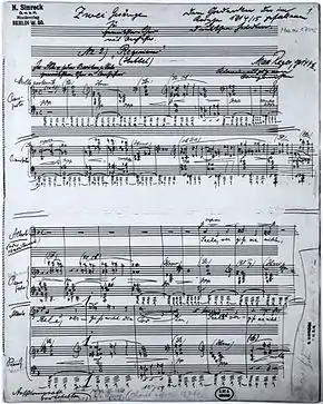 Page of sheet music, the autograph of Reger's Requiem of 1915, with handwritten title and dedication on the lines for musical notation