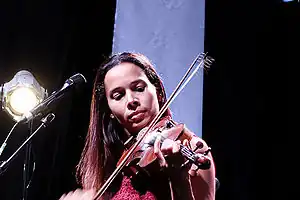 Rhiannon Giddens with a stringed instrument