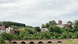 View of Rieneck with church, castle and bridge over the Sinn river