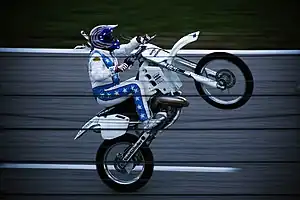 Robbie Knievel performing a wheelie