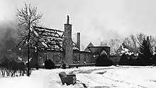 Rockwood Lodge burning with only part of the walls and chimney remaining