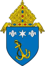 The arms of the Archdiocese of Anchorage: The anchor references the namesake of the see, Anchorage, Alaska.