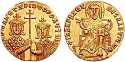 Obverse (right) and reverse (left) view of gold coin. On the obverse, Christ seated on throne. On the reverse, two crowned men, one bearded and one not, holding a patriarchal cross on a staff between them.