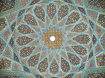 Complex girih patterns with 16-, 10- and 8-point stars at different scales in ceiling of the Tomb of Hafez in Shiraz, 1935