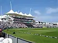 Main pavilion at the Rose Bowl. The England team are taking to the field in a friendly match against Hampshire.