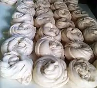 Round spiralled dough ball which gives Parotta its flaky layers.