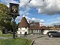 A replica Kentish oast house, now the Royal Oak pub, The Oast House was added to the original pub.